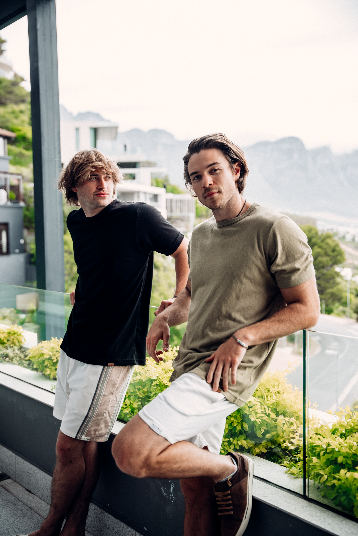 KOIKOI mens linen trousers in natural, styled lifestyle shot